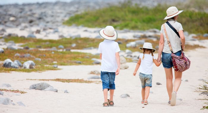 Family walking on Galapagos beach