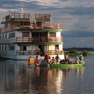People canoeing outside of the ship
