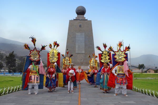 Middle World Monument with costumed people in front