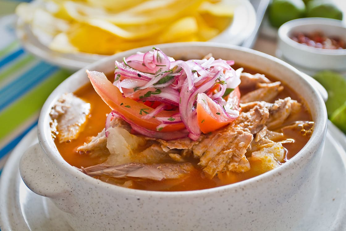 Encebollado Fish Stew Served With Banana Chips And Lemon Typical