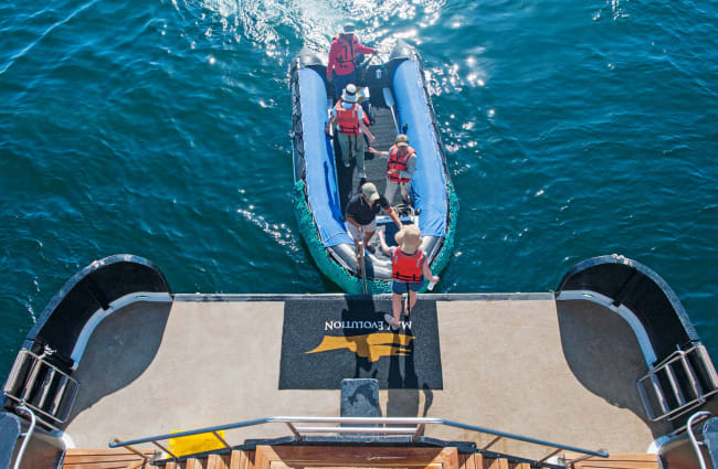 People boarding form the skiff