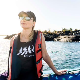 A woman leaning on a skiff