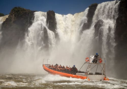 People,In,Boat,To,See,The,Waterfalls,Up,Close,-