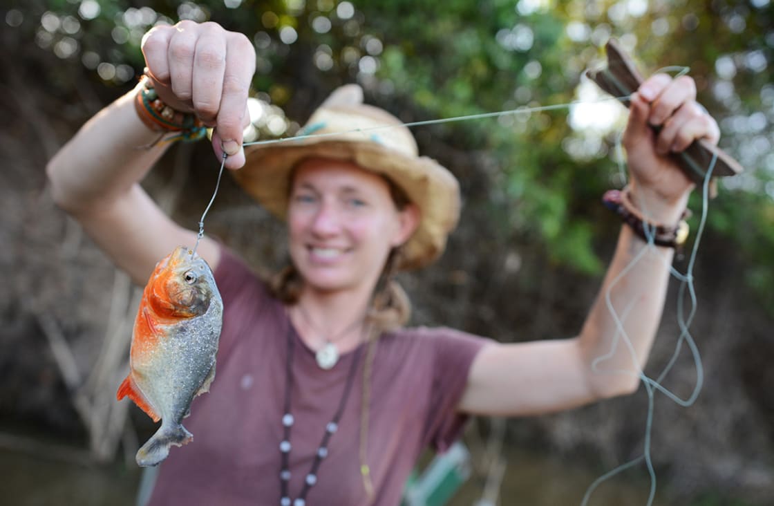 Young Woman is Piranha Fishing